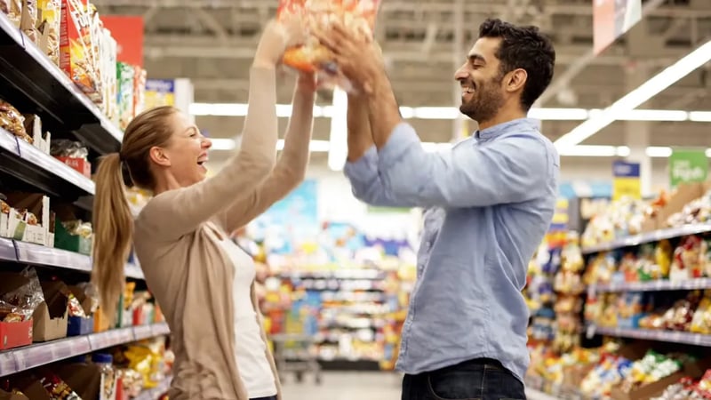 Veo 3.1 Lite text to video: two shoppers reach for the same cereal box on a supermarket shelf